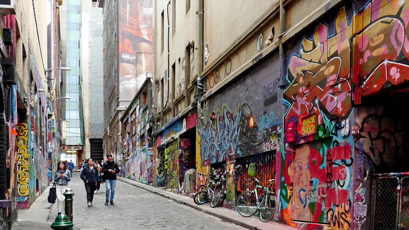 Layered street art murals along Hosier Lane in central Melbourne