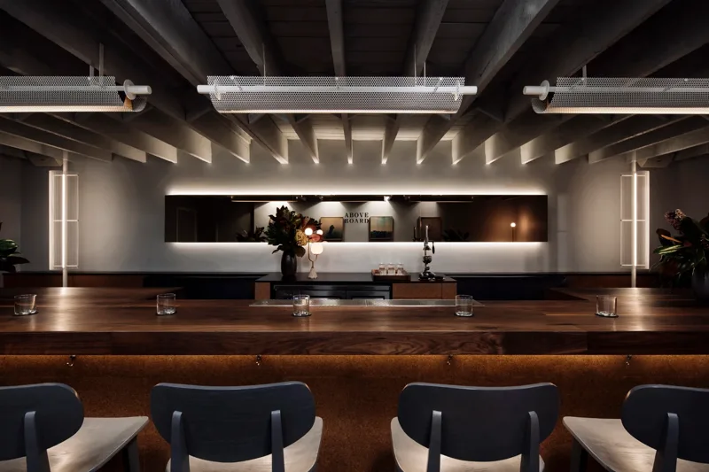 The candlelit walnut bar and cork-clad room at Above Board, Collingwood
